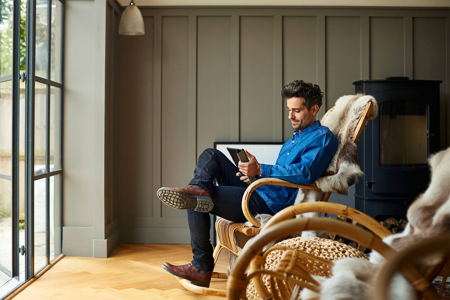 Man in chair at peace arranging fully digital insurance